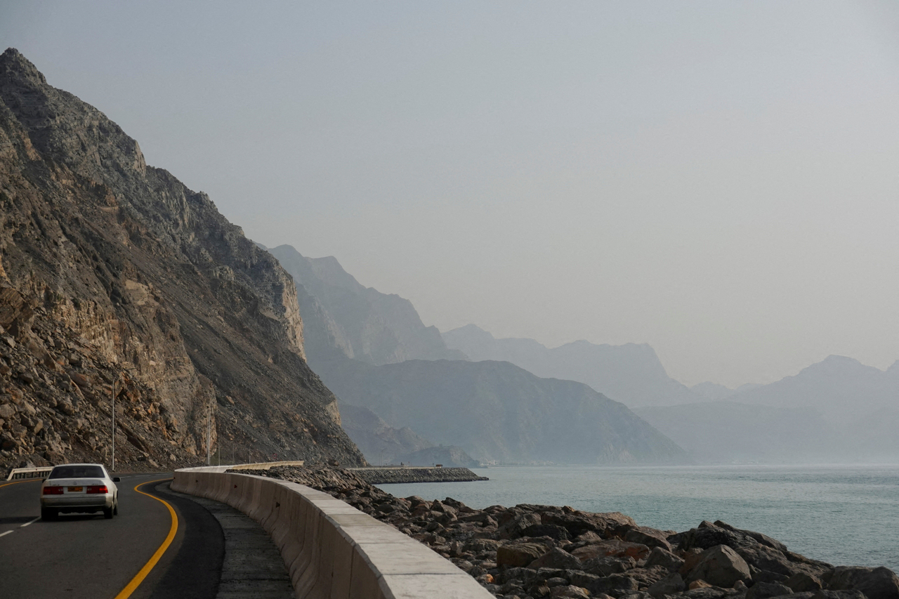 A car rides along the coast of Musandam overlooking the Strait of Hormuz, in Oman in March. (Reuters-Yonhap)