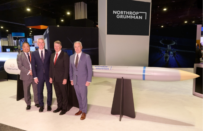 From left:  Kevin Schoonover, executive vice president of missiles at Hanwha Defense USA, Michael Coulter, CEO of Hanwha Defense USA, Frank Morley, vice president of international business development at Northrop Grumman, and Ron Boxall, vice president government programs at Northrop Grumman, pose for a photo after signing an agremeent at the Sea Air Space 2026 exhibition in National Harbor in Maryland. (Hanwha Aerospace)