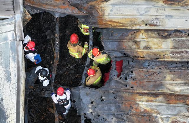 Firefighters search the scene of the Aricell battery plant fire in Hwaseong, Gyeonggi Province, on June 24, 2024. (Im Se-jun/The Korea Herald)