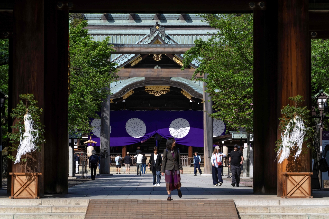 People visit Yasukuni Shrine in Tokyo on Wednesday, as part of the shrine's three-day spring festival. (AFP-Yonhap)