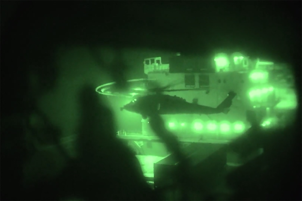 This screenshot from a video released by the US Central Command on their X account on Monday, shows US Marines boarding and seizing the Iranian-flagged vessel (US Central Command Public Affairs - AFP)