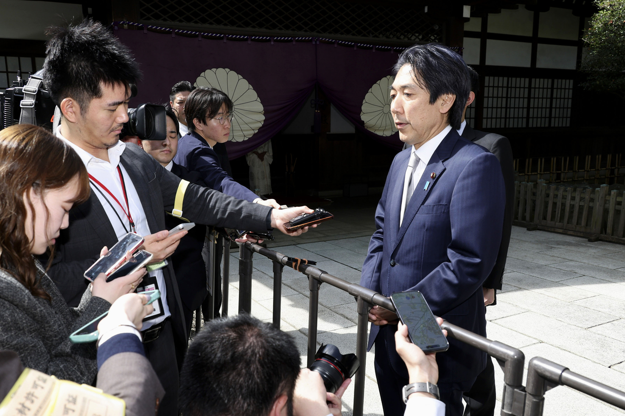 Kiuchi Minoru, minister of state for economic and fiscal policy of Japan, speaks to reporters after visiting Yasukuni Shrine in Tokyo on April 22, becoming the first Takaichi Cabinet member to visit the shrine. (Yonhap)