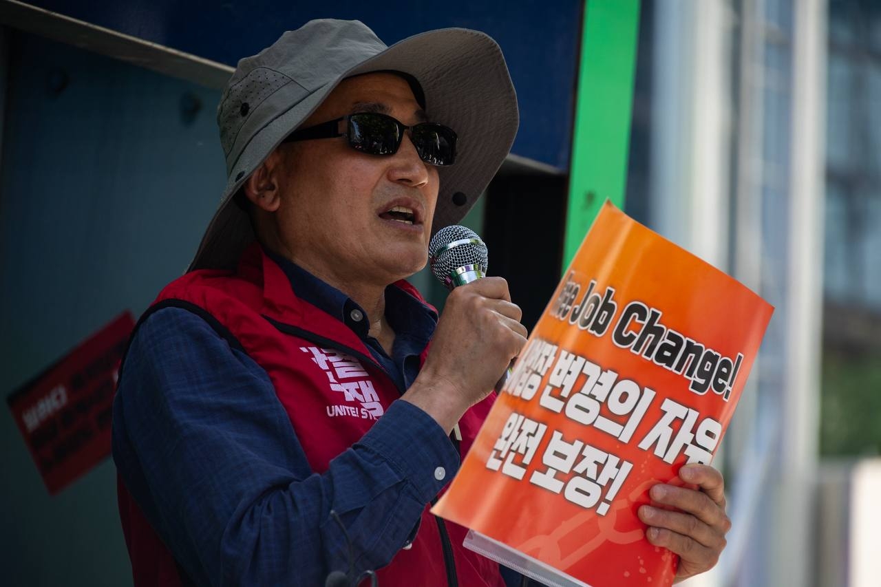 Udaya Rai, head of the Migrants Trade Union, speaks during a rally calling for migrant workers’ rights in central Seoul on Sunday. (KCTU)