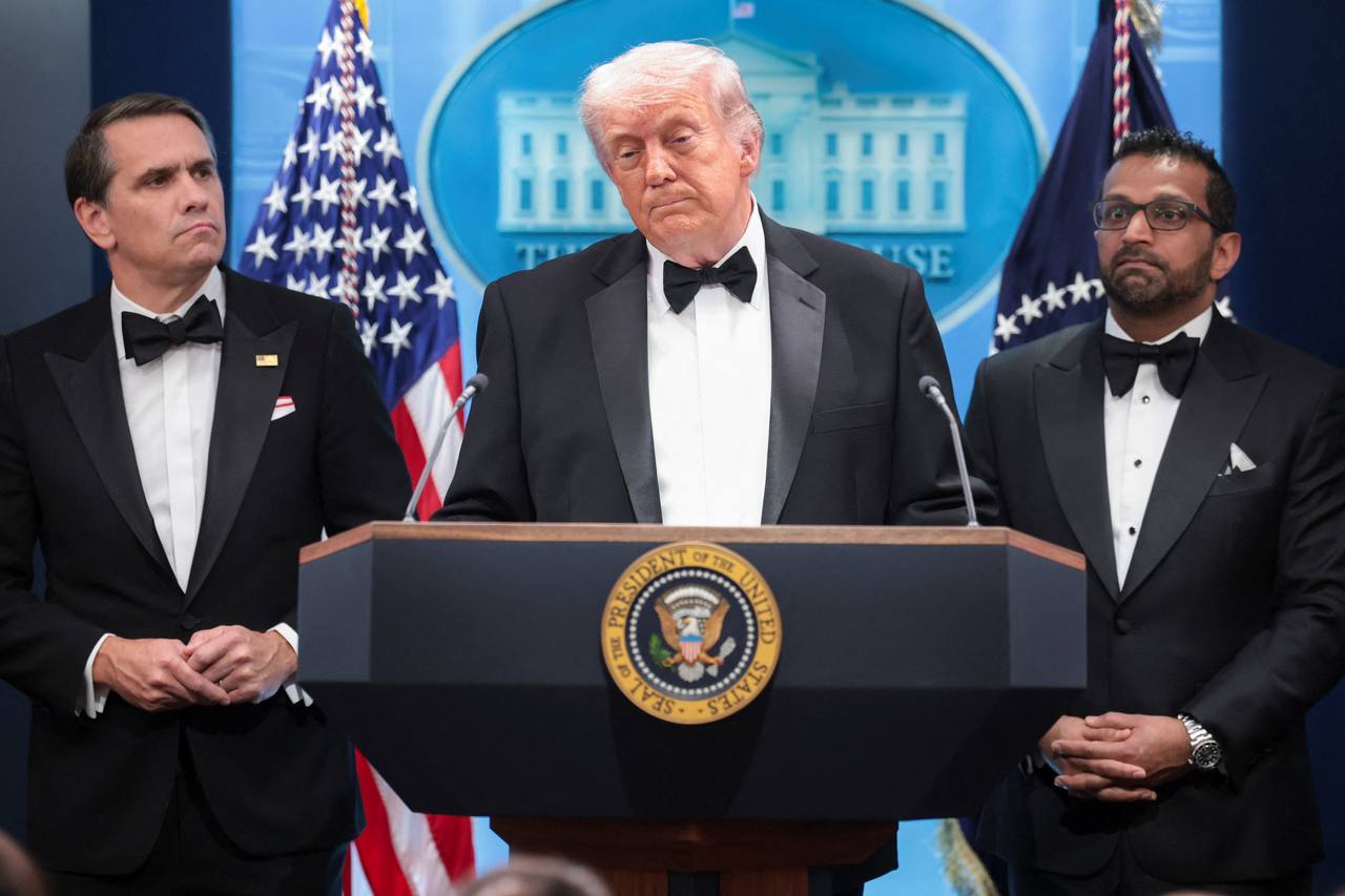US President Donald Trump speaks next to Federal Bureau of Investigation Director Kash Patel (right) and acting Attorney General Todd Blanche at a press briefing at the White House, following a shooting incident, in Washington, Saturday. (Reuters-Yonhap)