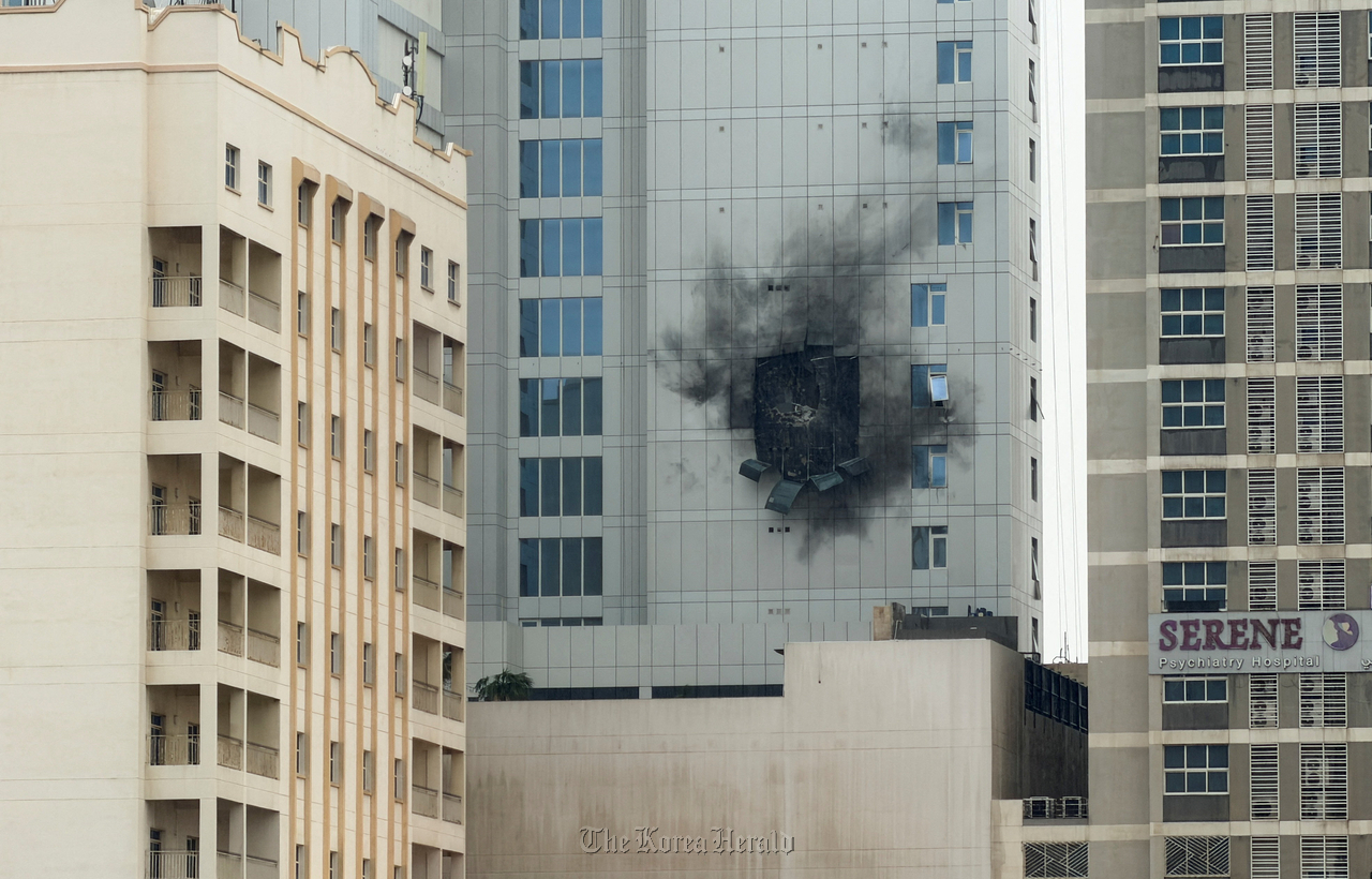 Damage caused by an Iranian drone strike on one of the buildings next to the Navy Base Headquarters of US Navy 5th Fleet in Juffair, Bahrain. (Yonhap/ Reuters)