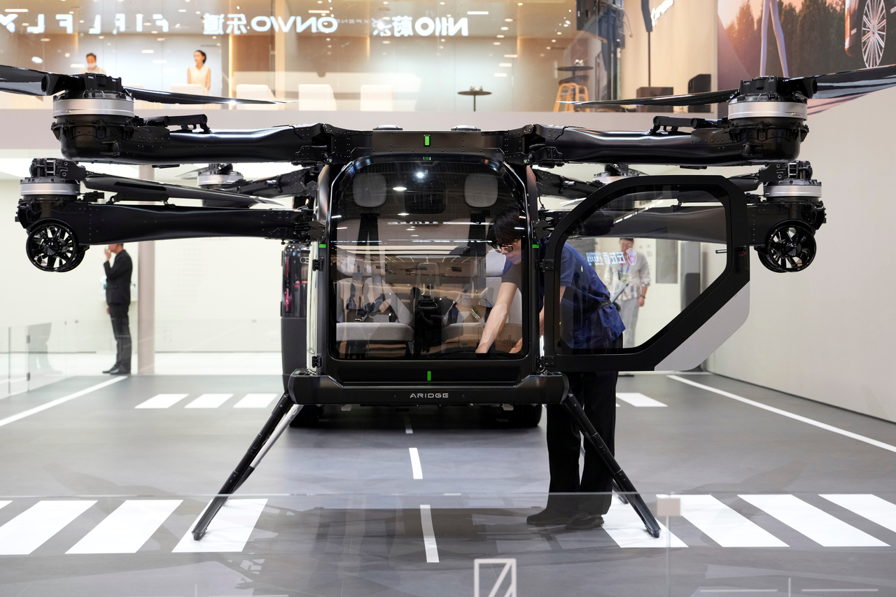 A worker prepares a flying vehicle from Xpeng at Auto China 2026 in Beijing, Friday. (AP-)