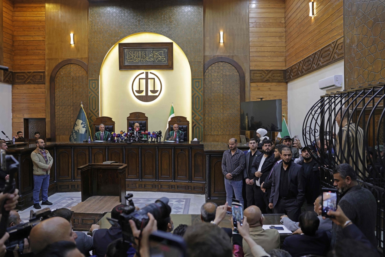 Former head of political security in south Syria's Daraa province, Atif Najib (right) attends a trial in Damascus, Syria, Sunday. (AFP-Yonhap)