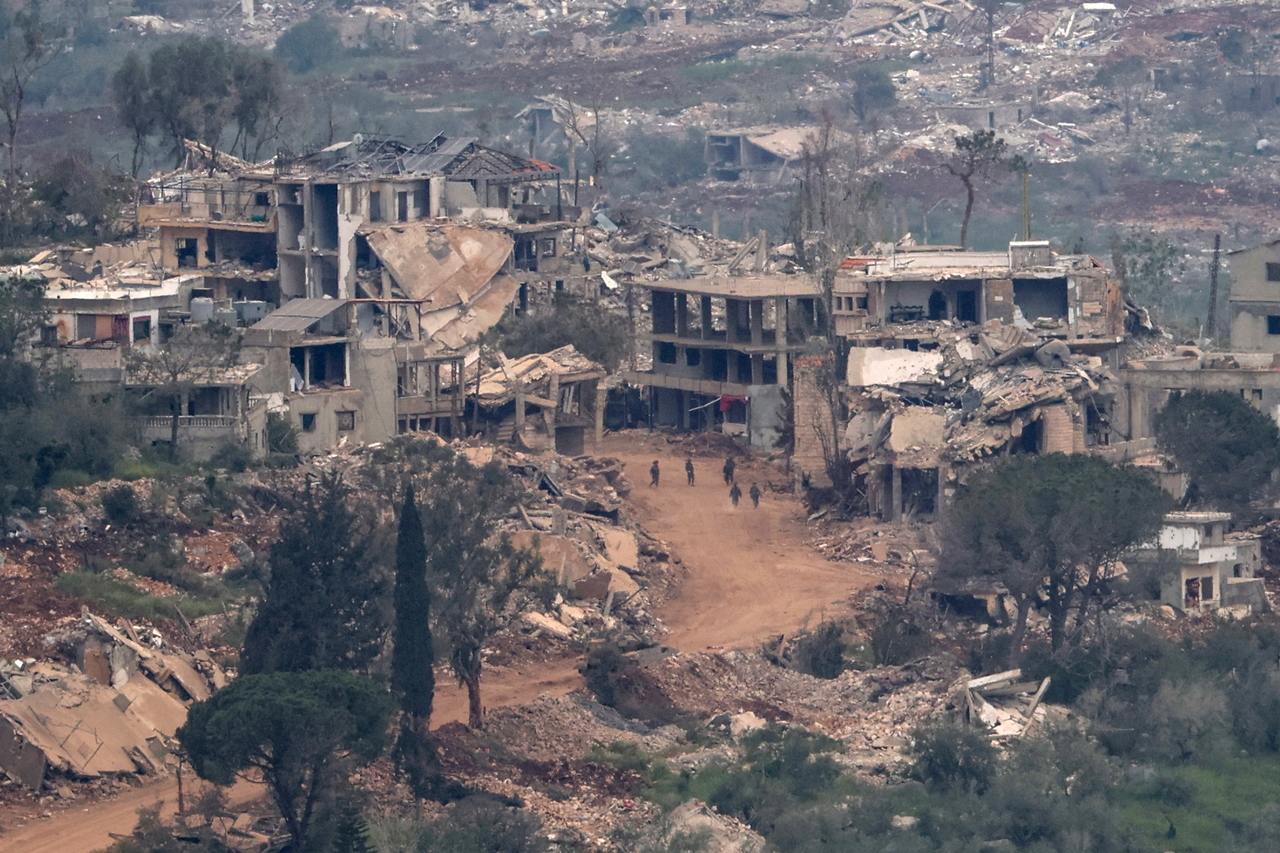 Israeli soldiers operate on the Lebanese side of the border as seen from northern Israel, Sunday. (EPA-Yonhap)