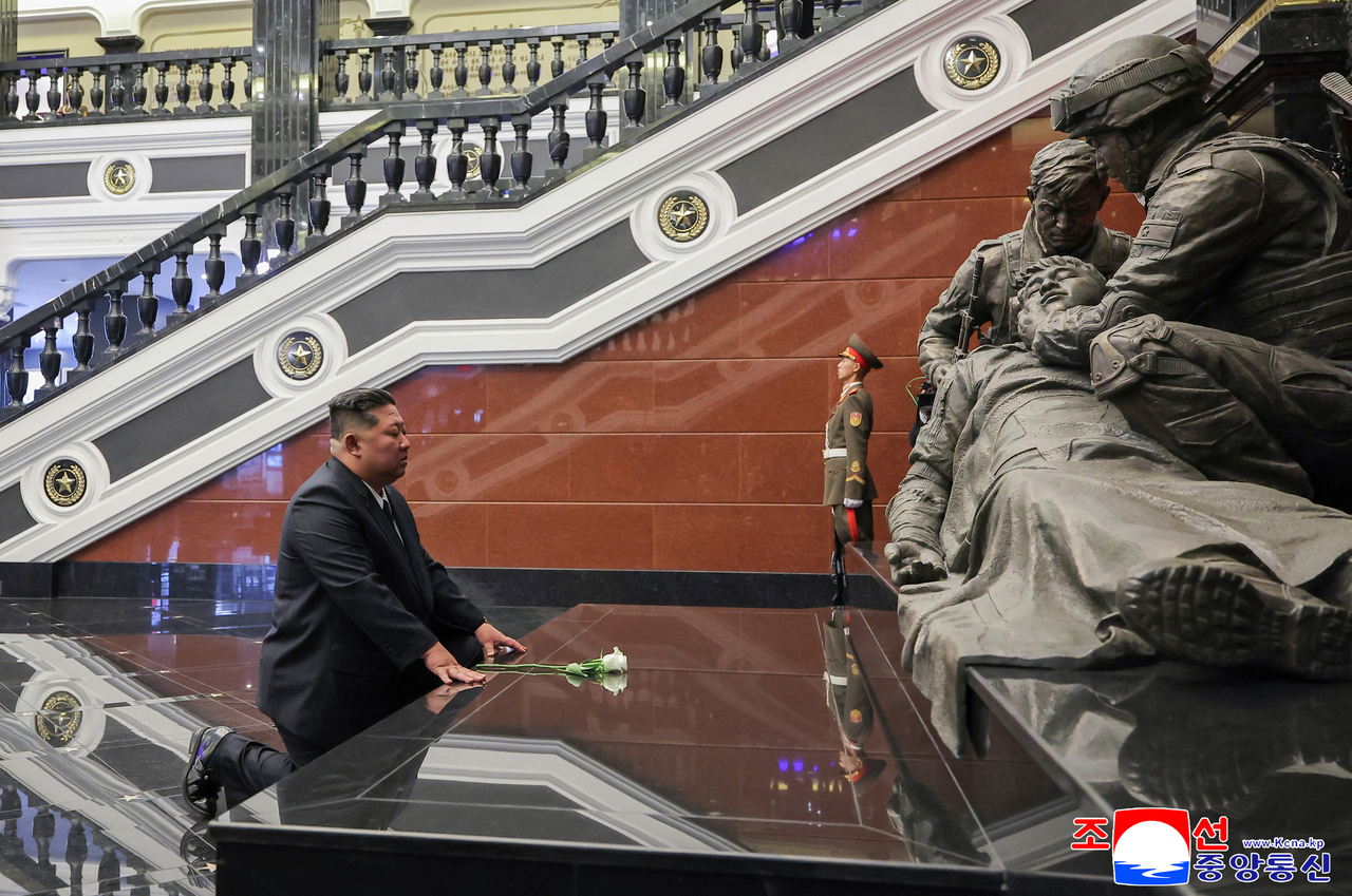North Korean leader Kim Jong-un is seen paying respects at the newly constructed museum dedicated to North Korean soldiers involved in overseas missions in a photograph released by Korean Central News Agency on Monday. (Yonhap)