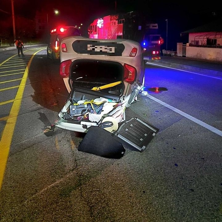 A car lies overturned after a crash near Daejin Beach in Donghae, Gangwon Province, Sunday (Gangwon State Fire Headquarters)