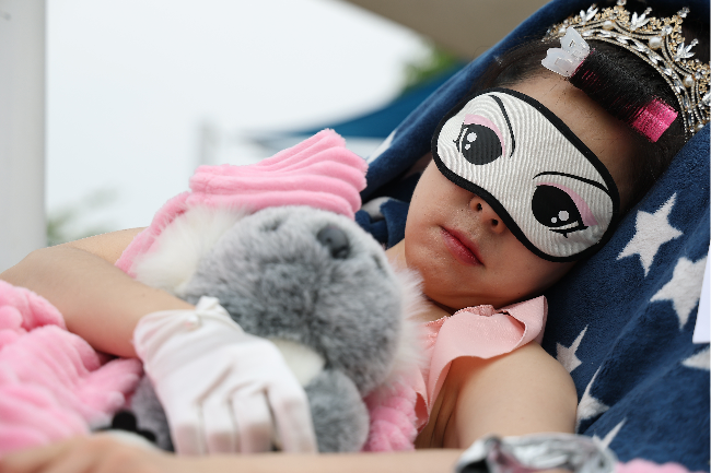 A participant dressed as a princess sleeps during the 2026 Hangang Nap Competition held on Saturday. (Yonhap)
