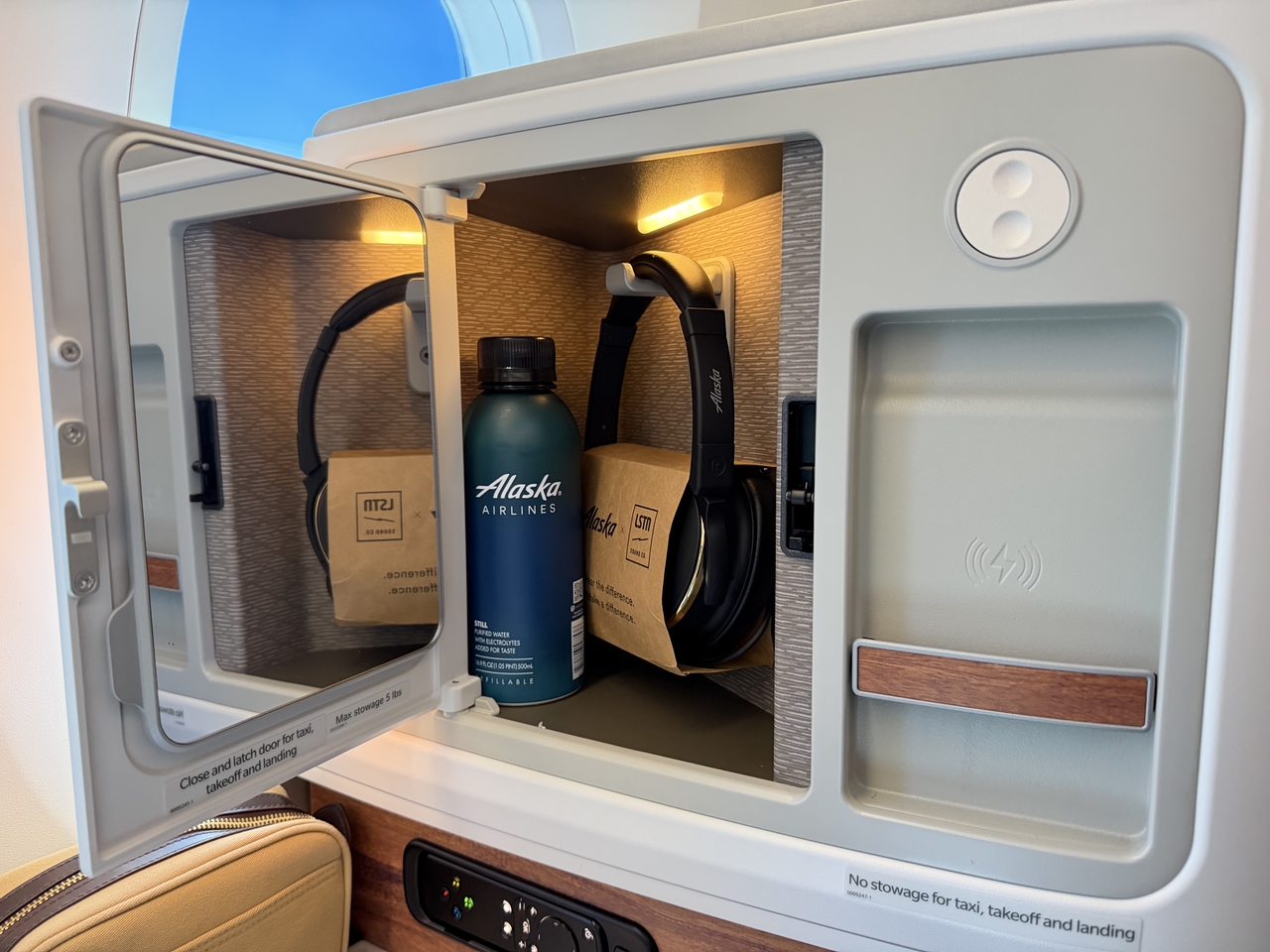 Headphones from premium audio brand LSTN slip into a discreet stowage compartment alongside a mirror and a custom reusable Path Water bottle. (Hong Yoo/The Korea Herald)