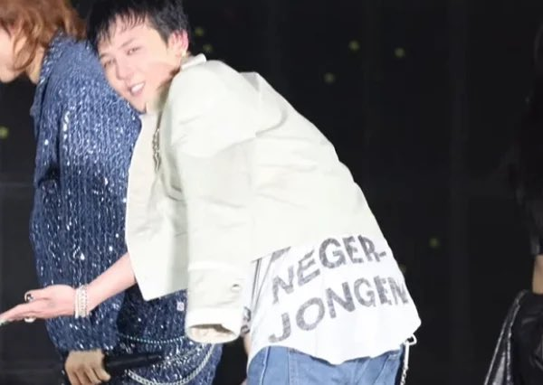 G-Dragon is pictured wearing a shirt printed with Dutch phrases carrying racial and sexual connotations during a concert in Macao on Saturday. (Screenshot captured from YouTube)