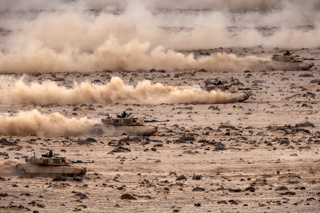 Abrams tanks roll in formation during in the annual "African Lion" joint military exercise between US and Moroccan forces in the Tan-Tan region in southwestern Morocco on May 31, 2024. (AFP-Yonhap)