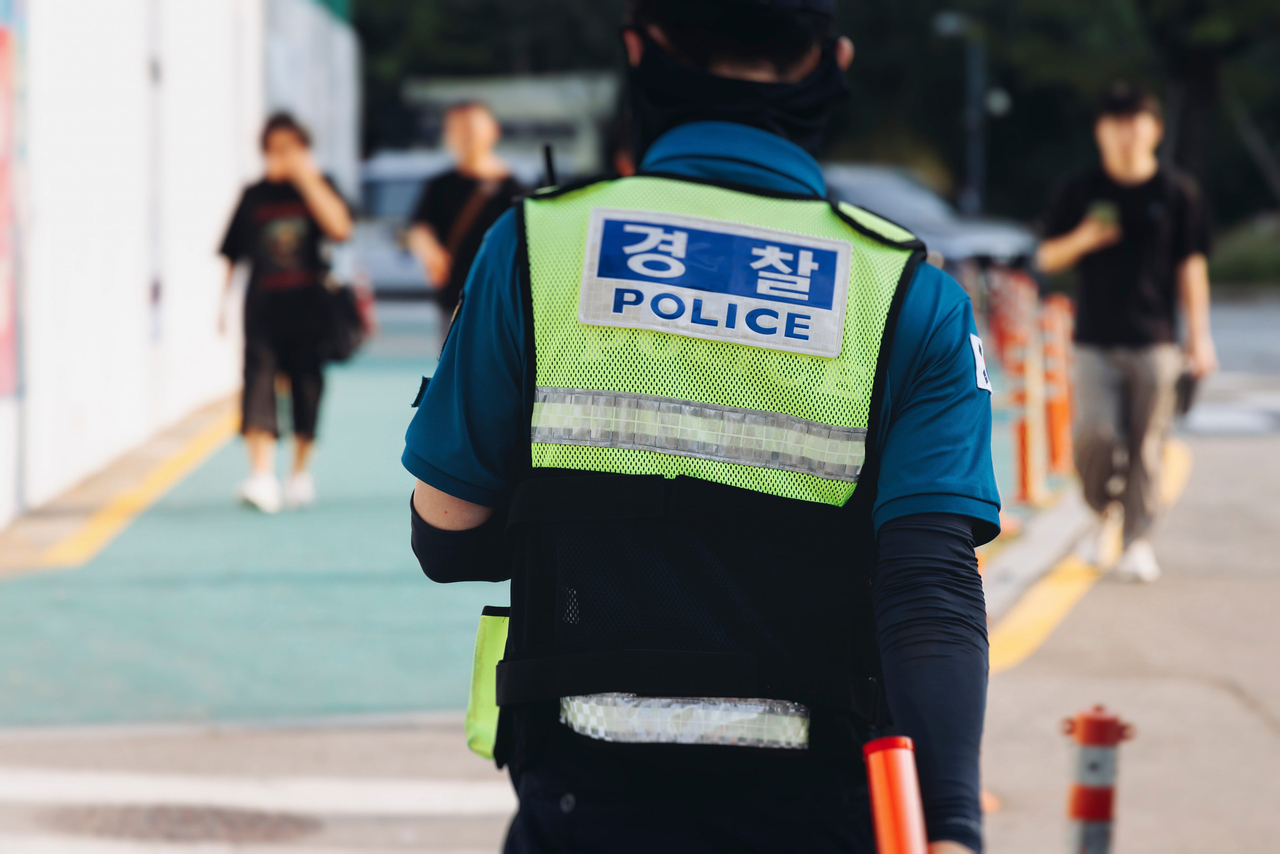 A South Korean police officer patrols during a demonstration in Seoul. (123rf)