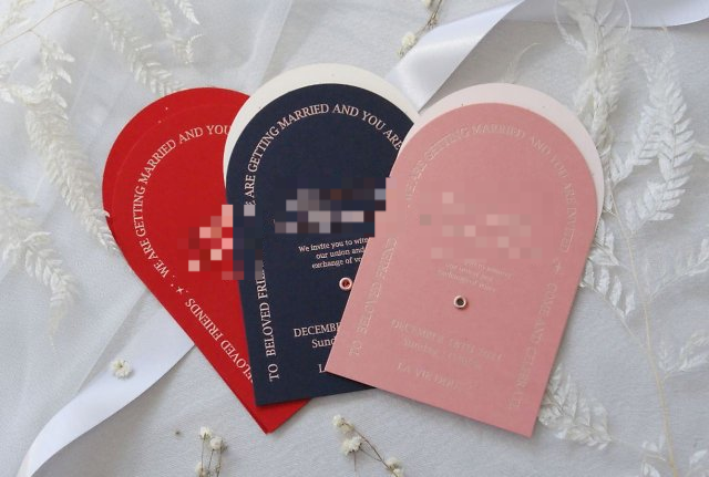 An unrelated photo of physical wedding invitations. (Herald DB)