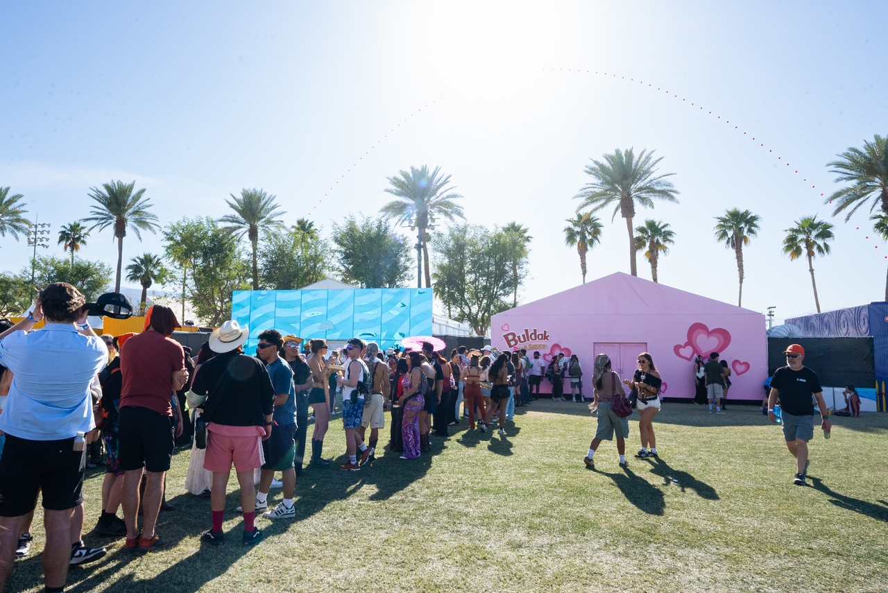 Attendees eagerly queue for a Buldak-themed booth, experiencing brand activation at the Coachella Valley Music and Arts Festival in 2025 (Samyang Foods)