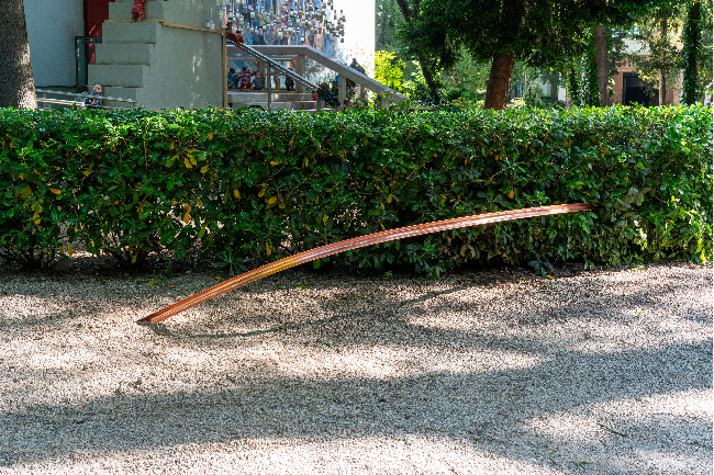 Choi Go-en's "Meridian" pierces through a hedge separating the Korean and Japanese pavilions at the Venice Biennale. (Courtesy of  Arts Council Korea)