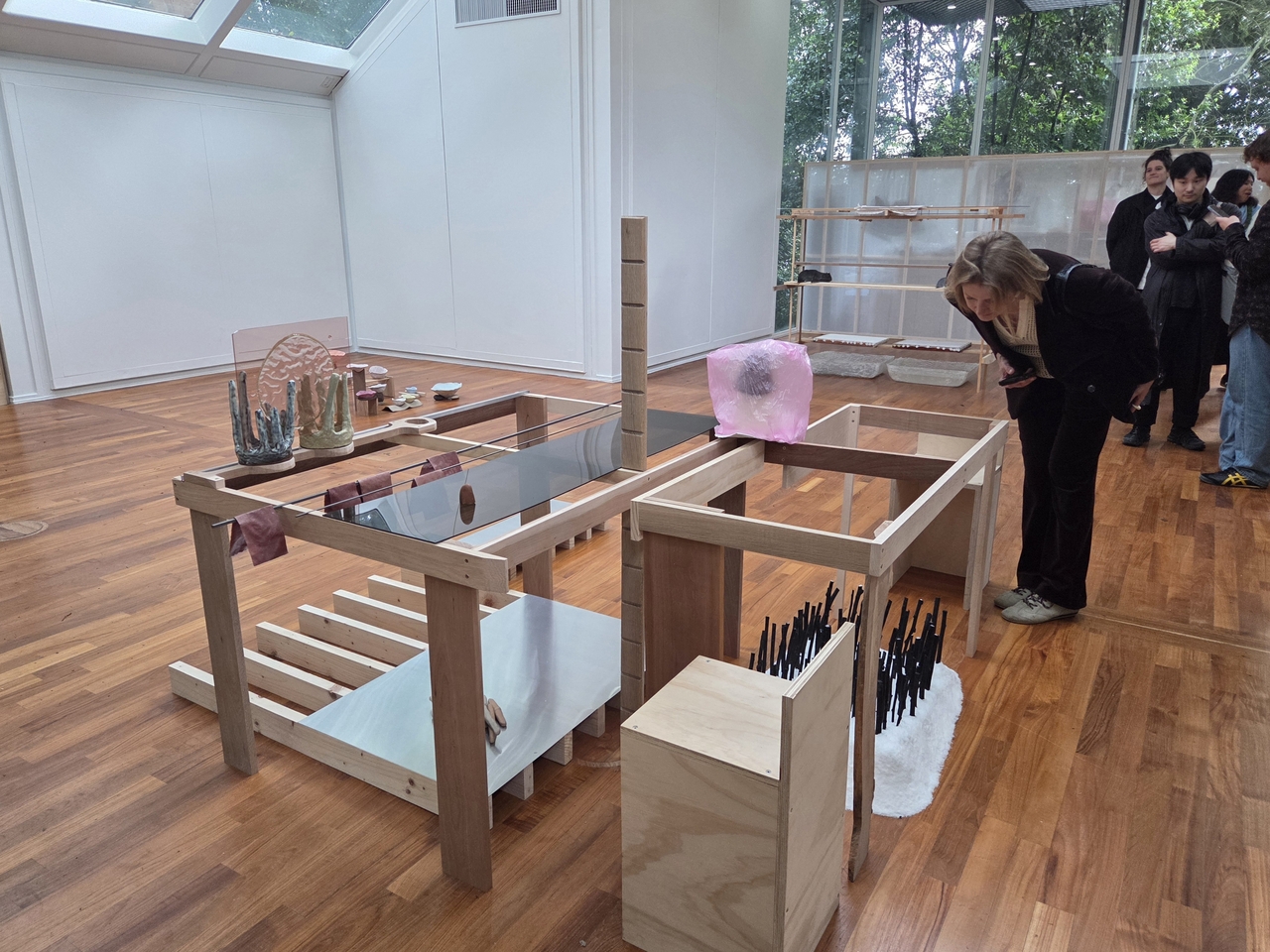 A visitor to the Korean Pavilion's exhibition "Liberation Space: Fortress/Nest" at the 2026 Venice Biennale takes a look at the Mourning Station on Wednesday that accommodates novelist Han Kang's "The Funeral."  (Park Yuna/The Korea Herald)