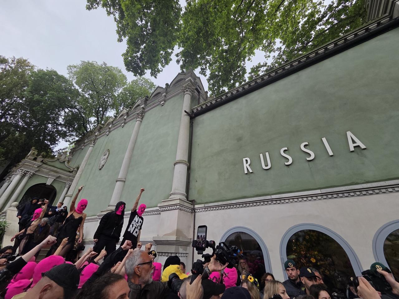 Protesters opposing Russia’s return to the 2026 Venice Biennale gather in front of the Russian Pavilion at the Giardini on Wednesday, the opening day of the biennale. (Park Yuna/The Korea Herald)