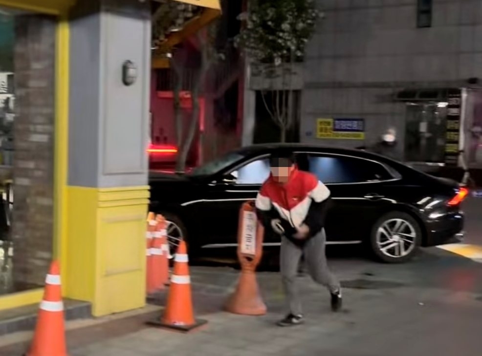 A man suspected of drunk driving, crashing into a commercial building and fleeing the scene in Gongju, South Chungcheong Province (Instagram @jubang_2_mo)