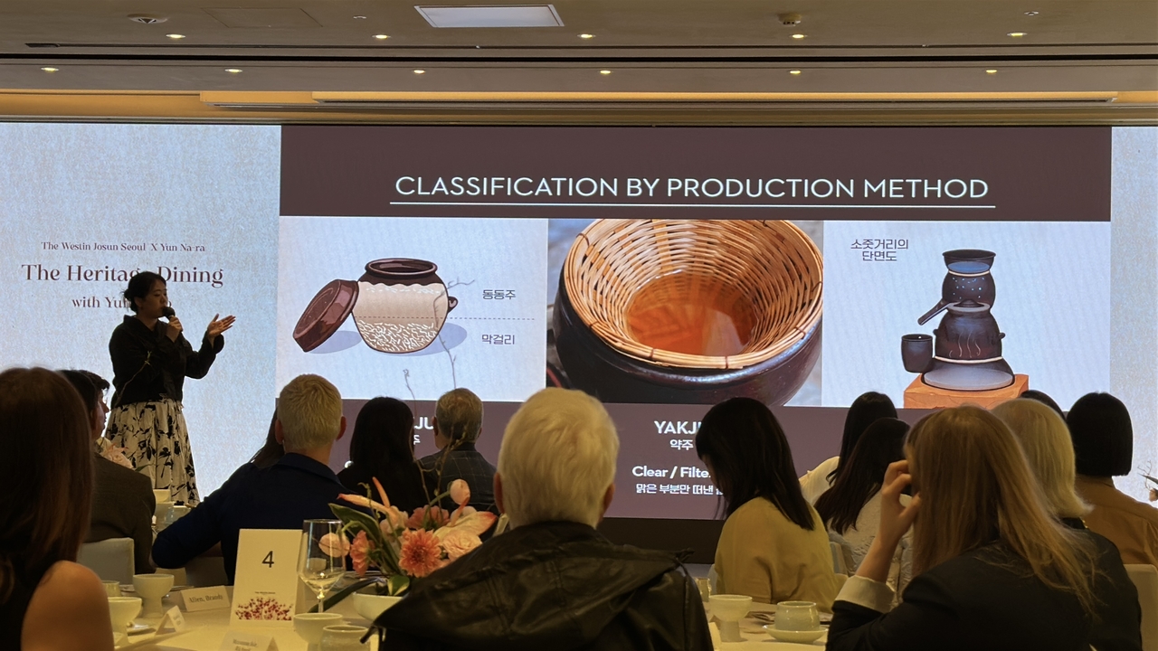Yun Jumo introduces guests to the history and brewing process of makgeolli during The Heritage Dining with Yun Jumo at The Westin Josun Seoul in Seoul on May 6. (Tammy Park/The Korea Herald)