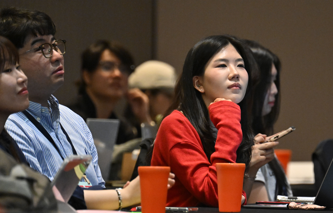 Participants listen to science communicator Orbit's lecture during H.eco Tech Festa 2026 held by the Herald Media Group. (Im Se-jun/ The Korea Herald)