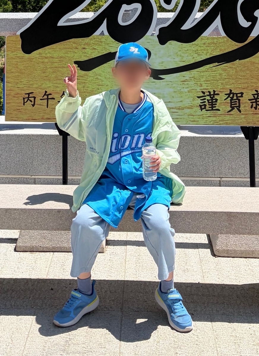 An 11-year-old boy wearing a Samsung Lions uniform poses for a photo during a family hike at Juwangsan National Park on Sunday before he went missing. (Yonhap)