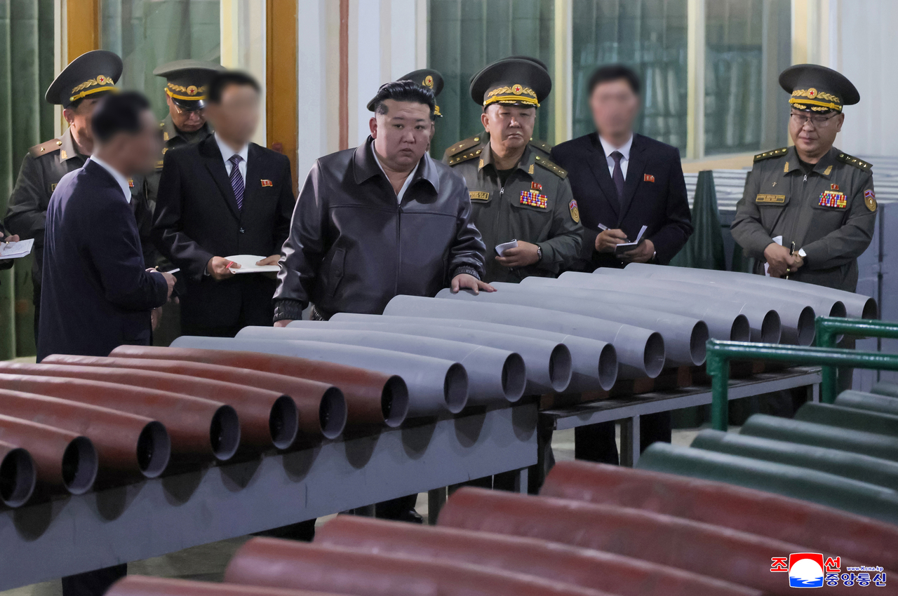 This photo, released by the Korean Central News Agency on Wednesday, shows North Korean leader Kim Jong-un visiting several munitions industrial enterprises on May 11 to review the implementation of military production tasks for the first half of 2026. (KCNA-Yonhap)