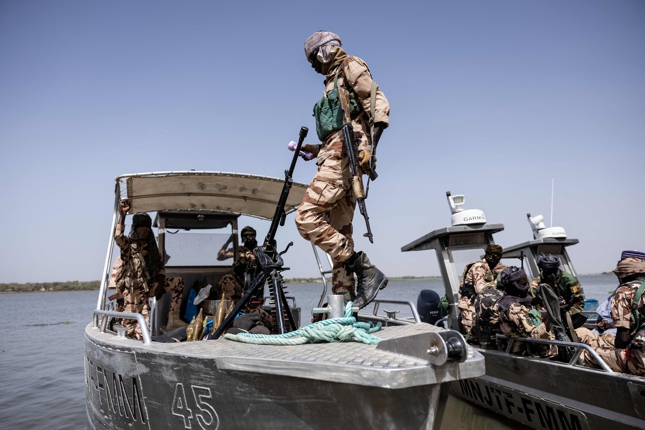 A Chadian soldier boards a Multinational Joint Task Force boat at a military base in Lake Chad Province on May 6. (AFP-Yonhap)