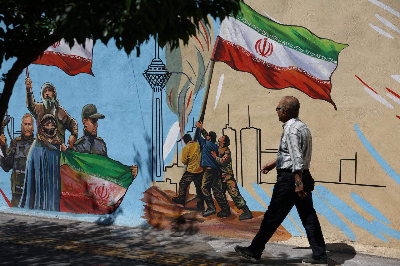 A man walks next to a mural on a street in Tehran, Iran, Monday. (Reuters-Yonhap)