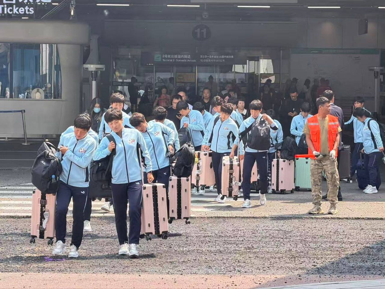 North Korea’s Naegohyang Women’s FC soccer players arrive at an airport in Beijing on Tuesday. (Inter-Korean Sports Exchange Association)