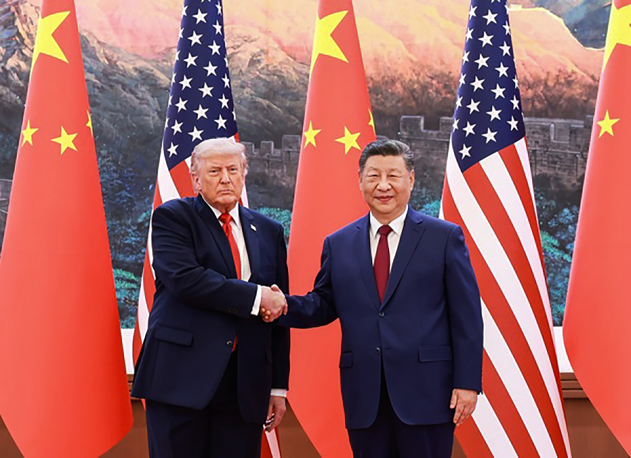 US President Donald Trump (R) shakes hands with Chinese President Xi Jinping at the Great Hall of the People in Beijing on Thursday. (United Press International)