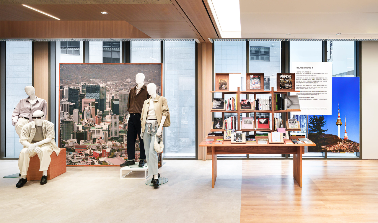 A dedicated bookshelf stocked with books and magazines about Seoul and Myeong-dong (Uniqlo Korea)