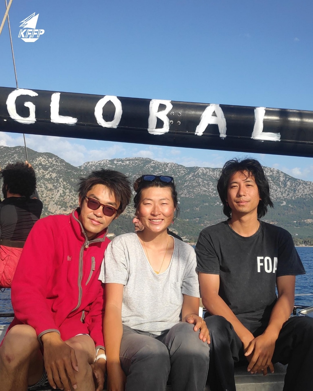 From left: Kim Dong-hyeon, Kim Ah-hyun and Jonathan Seungjoon Lee pose before departing for Palestine as part of an international aid flotilla. (KFFP)