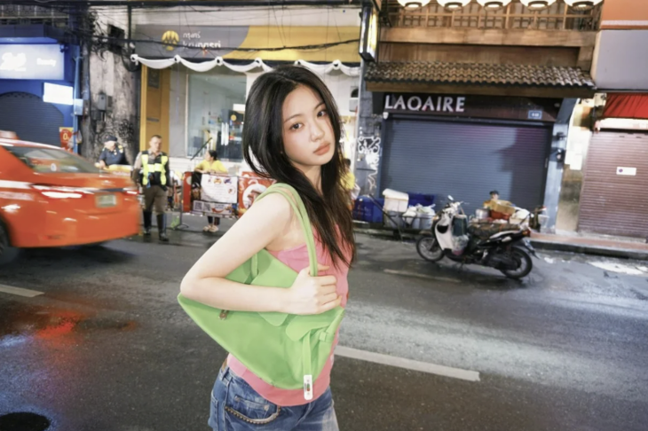 Kya from the K-pop girl group KiiKii holding a Firkin bag (KiiKii)