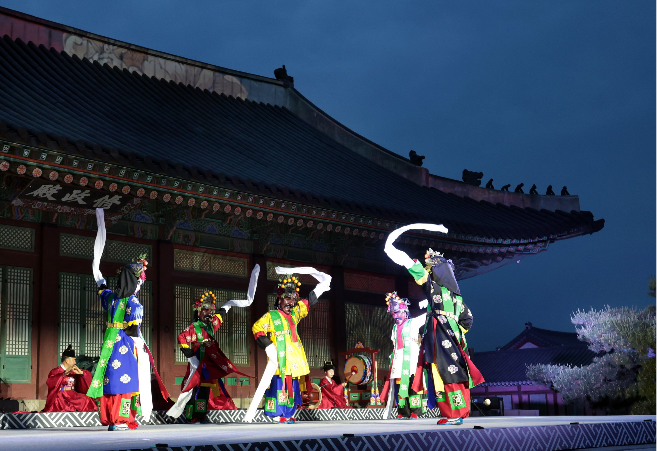 Members of the National Gugak Center perform "Cheoyongmu" during a final rehearsal at Gyeongbokgung on Tuesday, ahead of the opening of the "Seeds of Sound." (National Gugak Center)