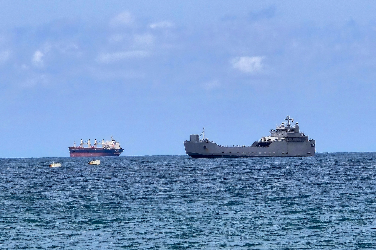 An Israeli naval vessel (right) is motored towards the Israeli port of Ashdod, about 40 kilometres south of Tel Aviv, on Wednesday after Israeli forces intercepted the Gaza-bound Global Sumud Flotilla. (AFP)