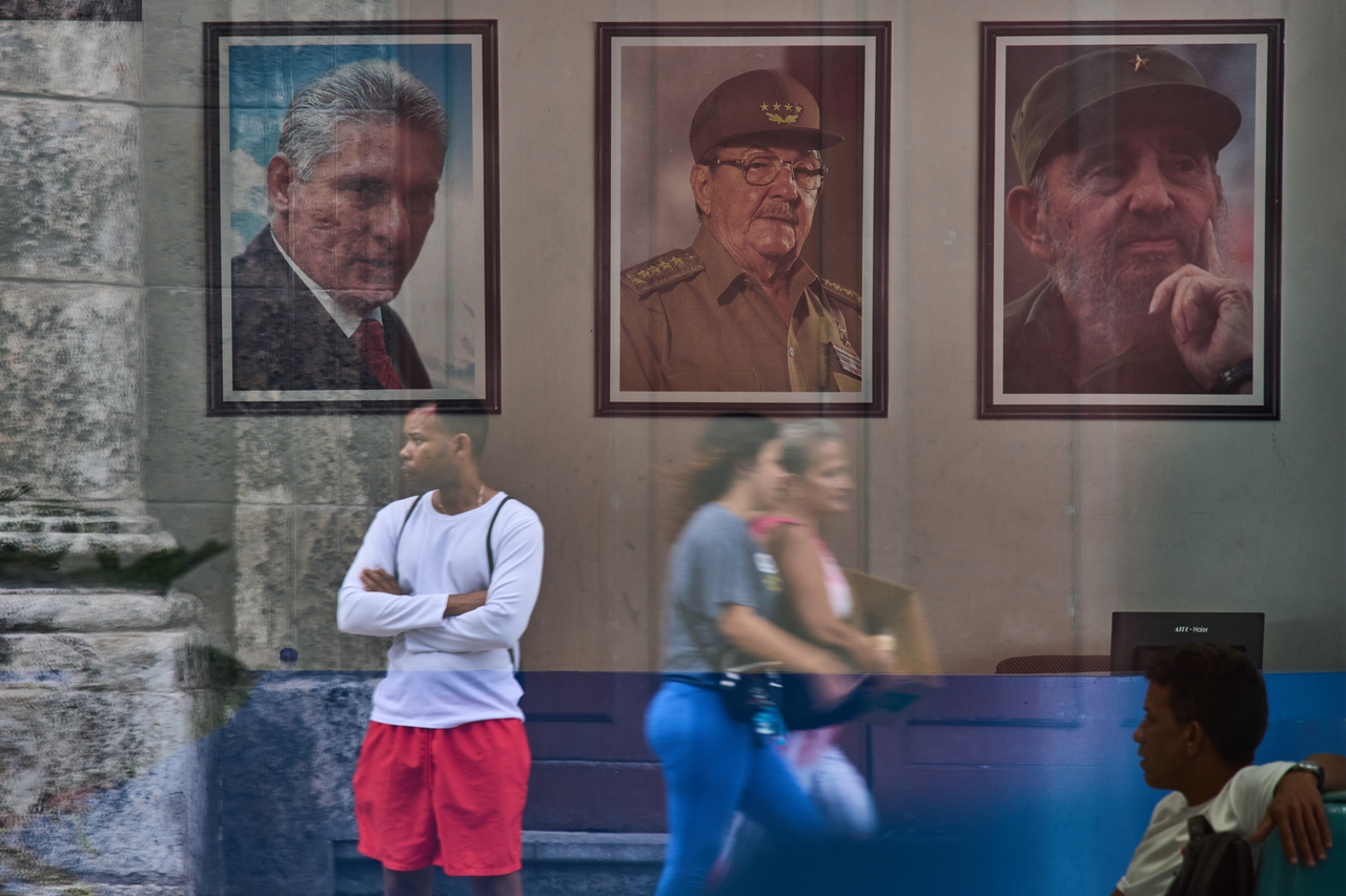 Images of Cuba's President Miguel Diaz-Canel (left), Raul Castro (center) and Fidel Castro are seen at the state building in Havana, Wednesday. (AP-Yonhap)