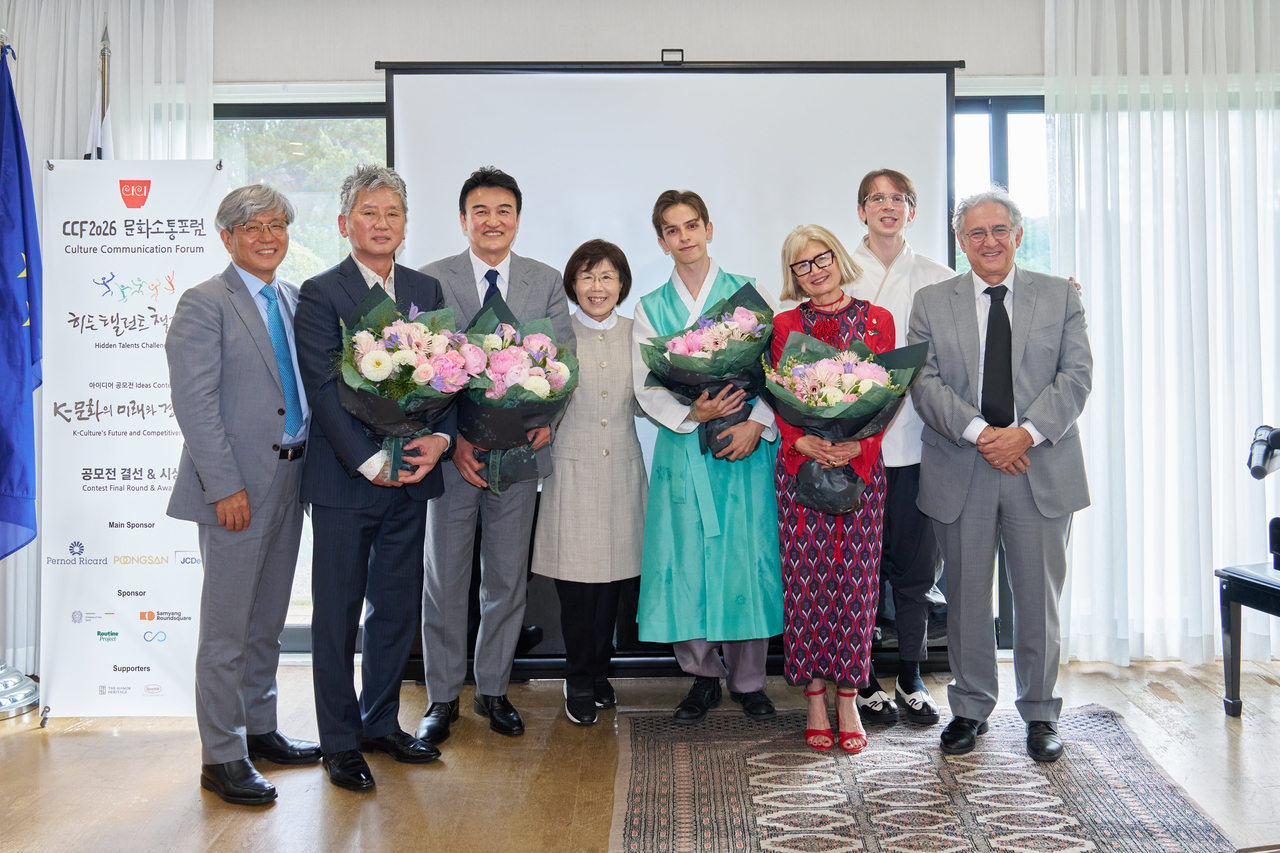 From left: Kim Seung-il, an acquaintance of the Italian ambassador; architect Hong Tae-sun; actor Park Joong-hoon; CICI Chair Choi Jung-wha; television personality and hanbok ambassador Fabio; Italian Ambassador to Korea Emilia Gatto; Kim Hyun-sung of the Italian Embassy in Seoul; and Fabio Scapigliati, commercial attache at the Italian Embassy, pose for a photo during CCF 2026 held at the Italian ambassador’s residence in Seoul on Thursday. (CICI)