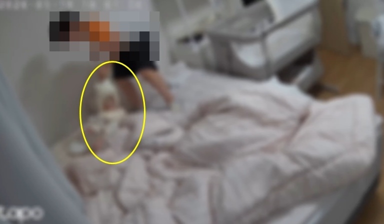 This screen capture of a video posted on Instagram shows a 9-year-old boy assaulting a baby while the baby's mother temporarily left the room.