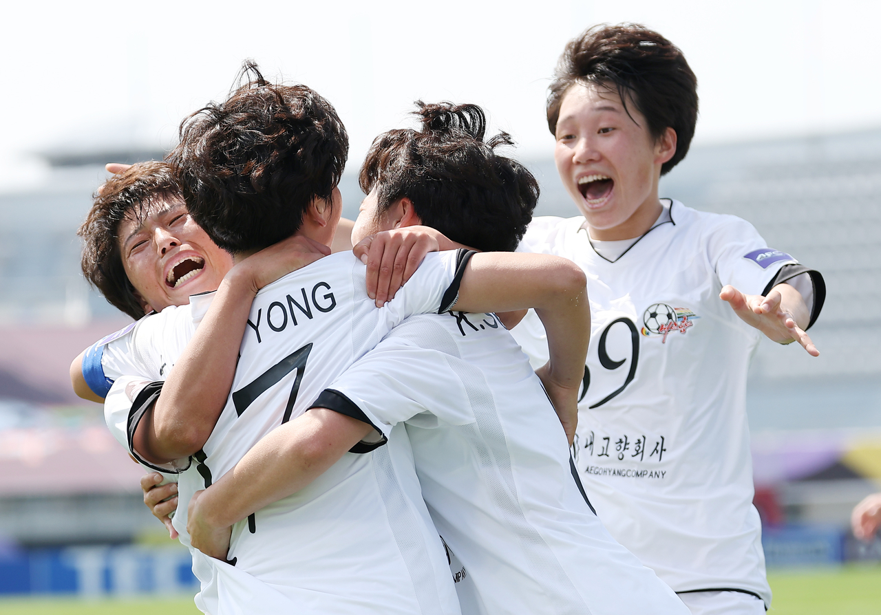 North Korean soccer club Naegohyang Women’s FC players celebrate after scoring the winning goal against Japan’s Tokyo Verdy Beleza in the AFC Women’s Champions League final in Suwon, Gyeonggi Province, on Saturday.