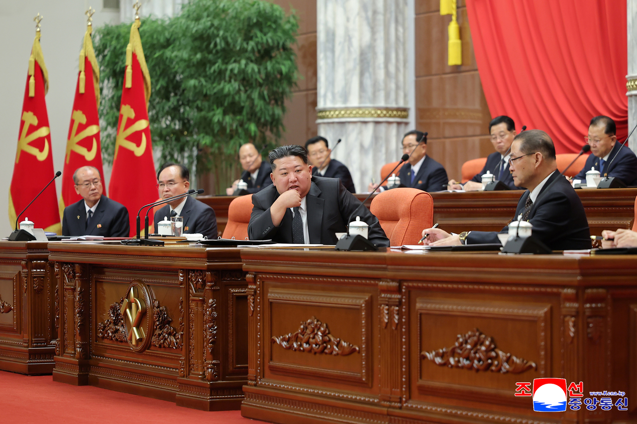 This photo shows North Korean leader Kim Jong-un (C) attending a party plenary meeting on Dec. 11, 2025. (KCNA)