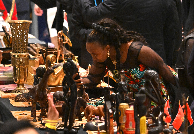 A participant looks at cultural products during Africa Day 2026 at the Grand Hyatt in Seoul on Wednesday. (Im Se-jun/The Korea Herald)