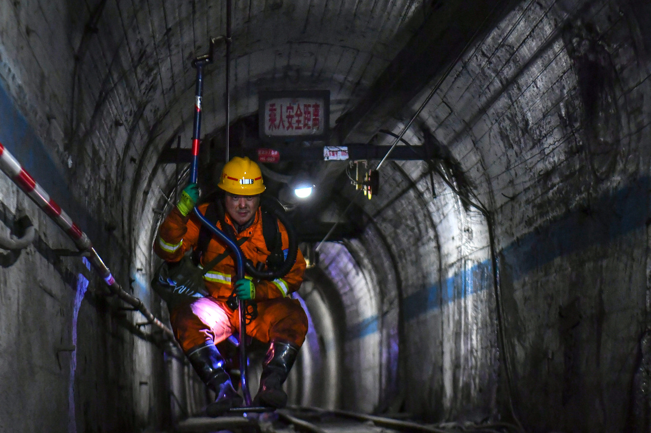 A rescuer comes up from the coal mine shaft after conducting search and rescue operation following a gas explosion at the Liushenyu coal mine facility in Qinyuan county in Changzhi, northern China's Shanxi province on Sunday. (Xinhua News Agency)