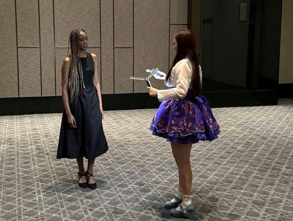 Mini, a TikTok creator whose real name is Kim Ha-min, films content with Fatou of Blackswan at Africa Day 2026, hosted by the African Group of Ambassadors in the Republic of Korea, The Korea Herald and the Korea-Africa Foundation in Seoul, Wednesday. (TikTok Korea)