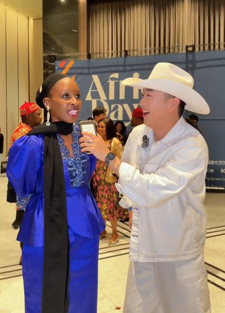 TikTok creator Luluboi, also known as Jamie Hwang, interviews a participant at Africa Day 2026, jointly hosted by the African Group of Ambassadors in the Republic of Korea, The Korea Herald and the Korea-Africa Foundation in Seoul, on Wednesday. (TikTok Korea)