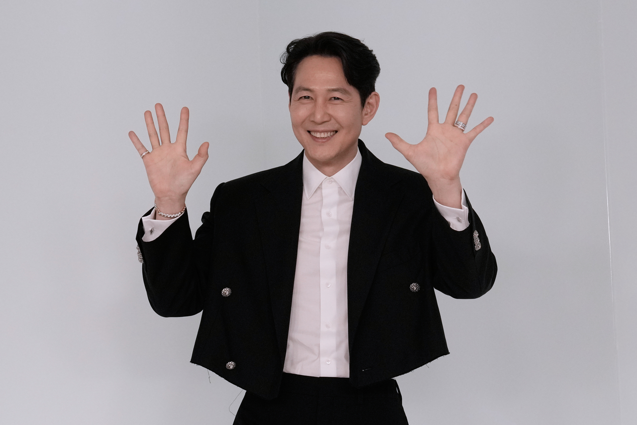 Lee Jung-jae poses during a photocall before the presentation of the Chanel Metiers d'Art 2026 collection in Seoul on Tuesday. (Ahn Young-joon/AP Photo)