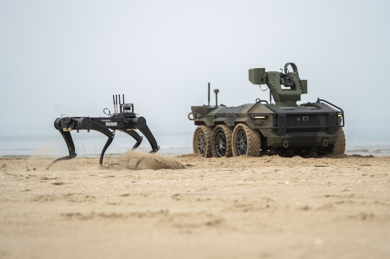 Hyundai Rotem's multi-legged walking robot (left) and multipurpose autonomous vehicle HR-Sherpa (Hyundai Rotem)