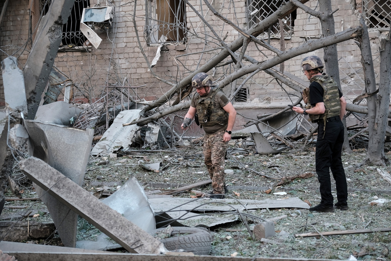 Ukrainian officials inspect the site following a Russian airstrike in Donetsk, Ukraine, Monday. (EPA-Yonhap)